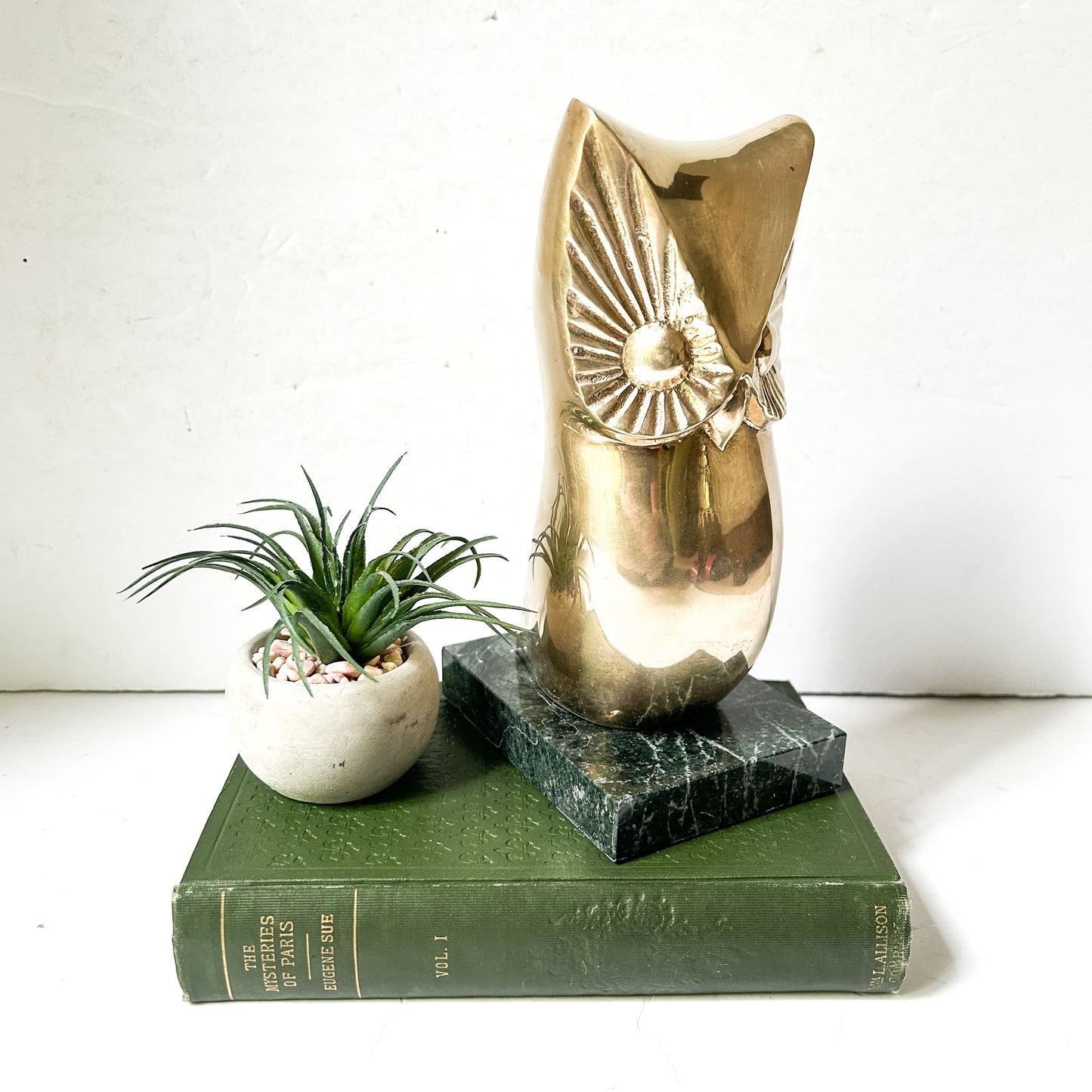 Vintage brass owl sculpture on green marble base